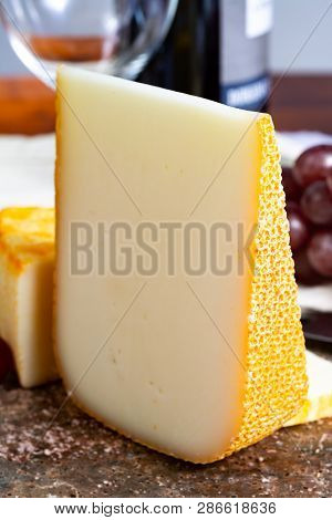 Pieces Of French Yellow Cheeses, Pur Brebis Sheep Melk Cheese Fron Pyrenees And Saint Paulin Creamy,