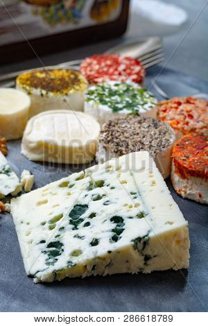 Colorful Assortment Of French Fresh White Soft Goat Cheeses With Different Tastes Topping Made With 