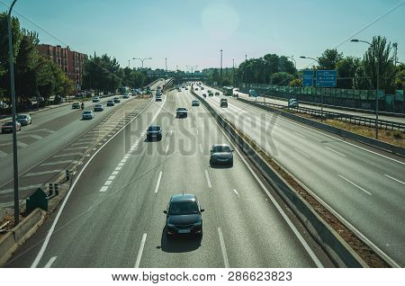 Sunlight Over Cars In A Multi Lane Highway With Heavy Traffic At Business District Near The Barajas 