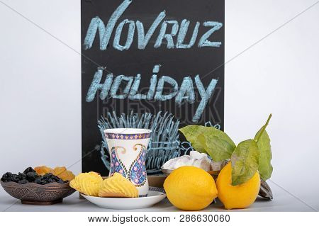 The Holiday Of Navruz. Traditional Armudu Tea Cup With National Patterns And Buta Print. On A Black 