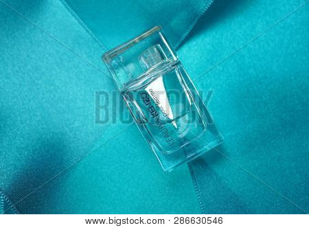 Prague, Czech Republic- January 22, 2019. Perfume KENZO bottle on blue background. 