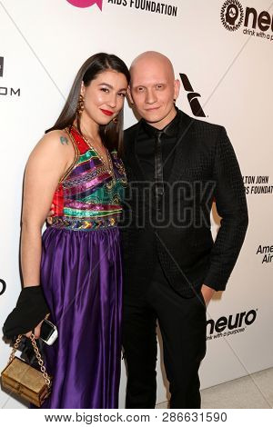LOS ANGELES - FEB 24:  Gia Olimp, Anthony Carrigan at the Elton John Oscar Viewing Party on the West Hollywood Park on February 24, 2019 in West Hollywood, CA