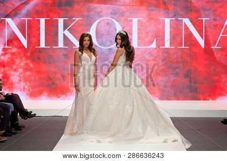 ZAGREB, CROATIA - FEBRUARY 02, 2019: Fashion models in wedding dresses posing on the runway at the Wedding fair