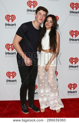 LAS VEGAS-SEP 19: Shawn Mendes (L) and Camila Cabello of Fifth Hamony attend the 2015 iHeartRadio Music Festival at MGM Grand Garden Arena Night 2 on September 19, 2015 in Las Vegas, Nevada.