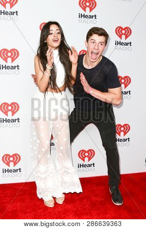 LAS VEGAS-SEP 19: Camila Cabello (L) and Shawn Mendes attend the 2015 iHeartRadio Music Festival at MGM Grand Garden Arena Night 2 on September 19, 2015 in Las Vegas, Nevada.