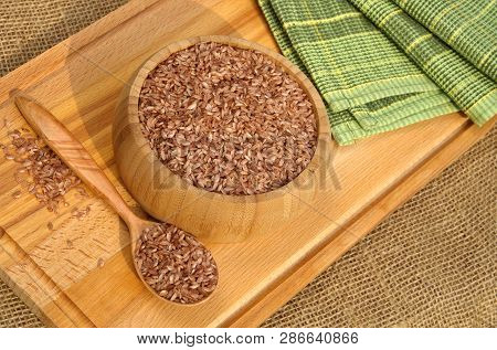 Uzbek Devzira For Cooking Pilaf On A Wooden Board