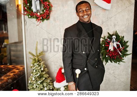 Stylish African American Gentleman In Elegant Black Jacket, Holding Retro Walking Stick As Cane Flas