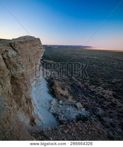 Panorama View To Aral Sea From The Rim Of Plateau Ustyurt Near Aktumsuk Cape At Sunset In Karakalpak