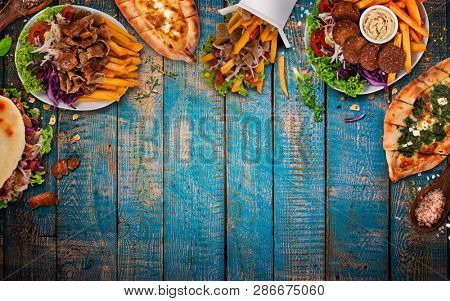 Top down view on traditional turkish meals on vintage wooden table. Close-up.