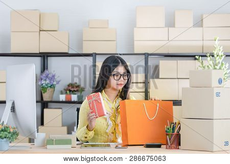 Young Attractive Asian Businesswoman, Long Black Hair, Wearing Glasses, Yellow Blouse, Recheck Order