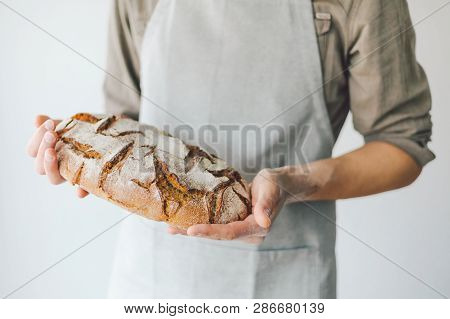 Baker Or Chef Holding Fresh Made Bread