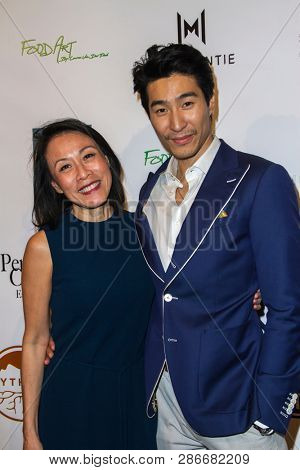 Tan Kheng Jua and Chris Pang arrive at The Rafi 2019 Pre-Oscars Gifting Lounge at the Waldorf Astoria Hotel, Beverly Hills, CA on Feb. 22, 2019.