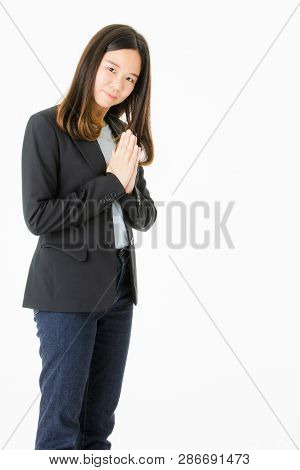 Young And Beautiful Long Balck Hair Asian Woman In Black Suit With Smile Face Showing Greeting In Th