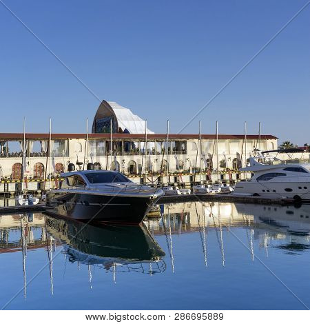 Sochi, Russia-june 14, 2018: Sea Port With Yacht Parking On The Background Of The Multimedia Screen 