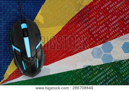 Seychelles Flag  And Computer Mouse. Digital Threat, Illegal Actions On The Internet