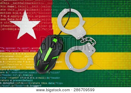 Togo Flag  And Handcuffed Computer Mouse. Combating Computer Crime, Hackers And Piracy
