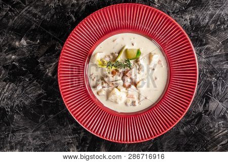 The Concept Of American Cuisine. Clam Chowder Potato Soup With Sea Food, Mussels, Salmon. Fish Broth