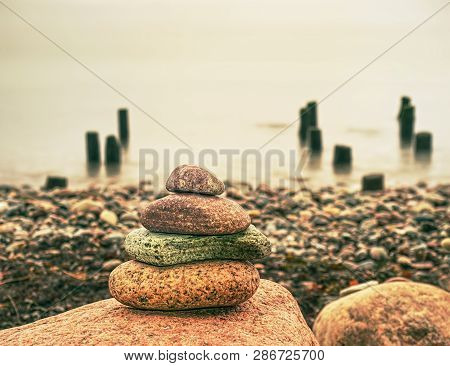 Stack Of Pebble Stone On Shingle Beach. Pile Of Stacked Stones On The Beach, Colorful Pebles Coast.