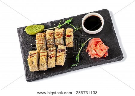 Concept Of Japanese Cuisine. Fried Roll In Deep-fried Banzai With Eel, Cucumber. Near Soy Sauce, Gin