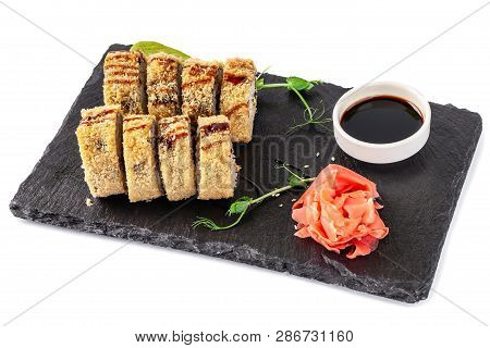 Concept Of Japanese Cuisine. Fried Roll In Deep-fried Banzai With Eel, Cucumber. Near Soy Sauce, Gin