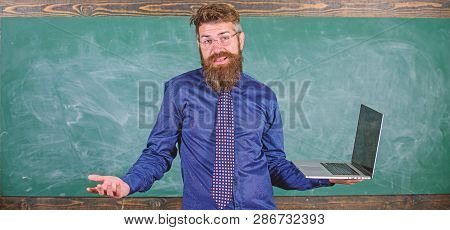 Teaching Issues Using Modern Technologies. Hipster Teacher Confused Expression Holds Laptop. Teacher