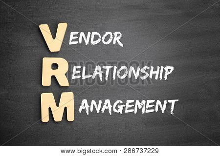 Wooden Alphabets Building The Word Vrm - Vendor Relationship Management Acronym On Blackboard