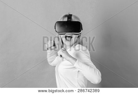 Person With Virtual Reality Helmet Isolated On Green Background. Woman With Vr. Virtual Reality Expe