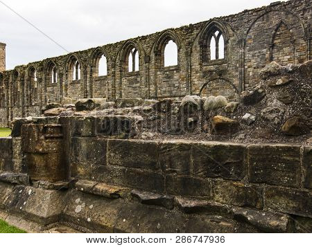 Textured Old Stone Wall With Gotik Windows.scotland, Uk