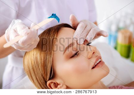Constant Client Of Beauty Salon Enjoying Painless Depilation