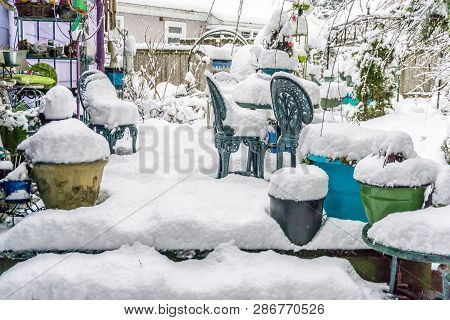 The Back Porch Of A Home In Burien, Washington Is Buried In Snow.