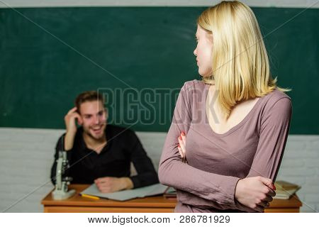 Speaking In Front Of The Class. University Student. High School Student Answering At Seminar. Female