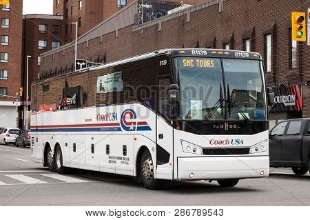 Ottawa, Canada - November 11, 2018: Coach Usa Logo On A  Motorcoach Bus Passing By In The Streets Of