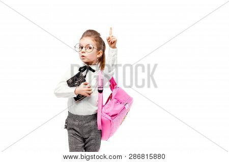 Back To School. Beautiful Little Girl Dressed Like A School Girl - In White Shirt And Gray Pants, Ro