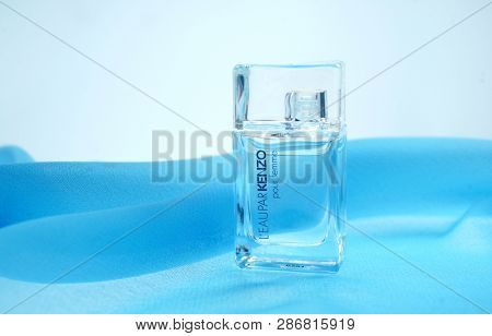 Prague, Czech Republic- January 22, 2019. Perfume KENZO bottle on blue background. 