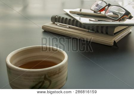 1 Cup Of Chinese Tea To Relax From Working With Cameras, Glasses, Mobile Phones, Car Keys, Pens And 