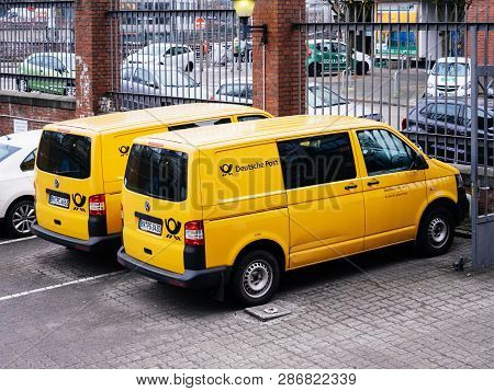 Hamburg, Germany - Mar 22, 2018: Two Deutsche Post  Dhl Vans From Above In Parking Of Postal Office