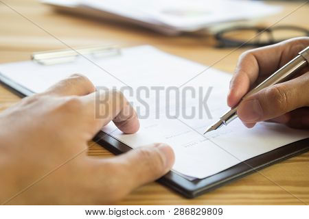 Business Man Signing A Contract. Owns The Business Sign Personally, Director Of The Company, Solicit