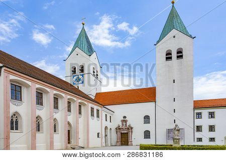 Spires Freising Cathedral  In Germany Under Blue Sky