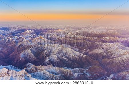 Beautiful View From The Aircraft To The Mountains Of Himalaya In China,  Covered With Snow