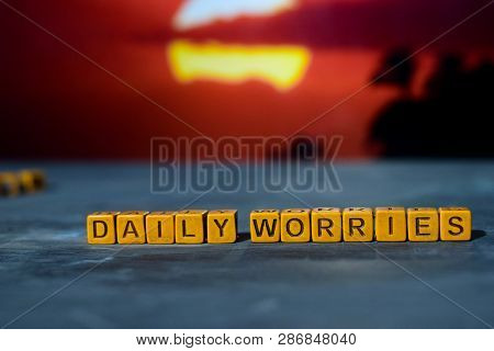 Daily Worries On Wooden Blocks. Cross Processed Image With Bokeh Background