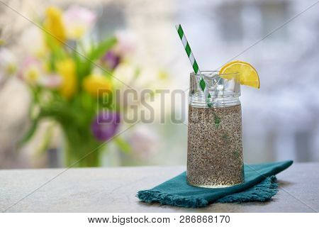 Chia Seeds In Glass Of Water On Stone Table
