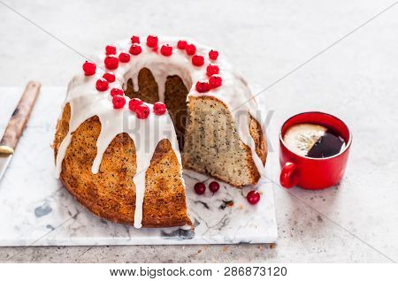 Sliced Lemon Poppy Seed Bundt Cake With Sugar Glaze And Redcurrant