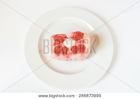 Fresh Cutting Raw Oxtail Or Beef With Bone, Tail Path Of Cow On White Plate And White Background. Ox