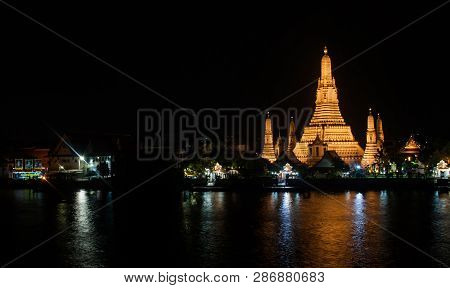 Wat Arun Historical Park And The Chao Phraya River At Night