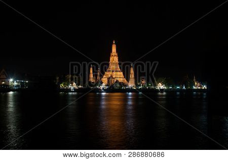 Wat Arun Historical Park And The Chao Phraya River At Night