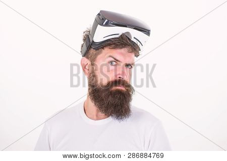 Happy Bearded Man Wearing Virtual Reality Goggles Watching Movies Or Playing Video Games. The Man Wi