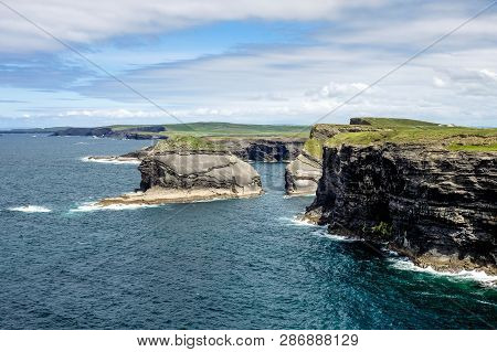 Cliffs Of Kilkee In Co. Clare, Ireland. Peninsula In West Clare, Ireland. Famous Beach And Landscape