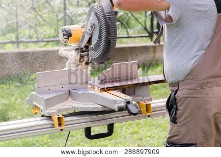 Master Carpenter At Work In The Workshop Outdoors. Carpenter Han
