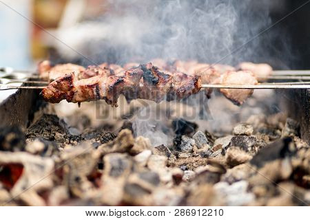 Close Up Marinated Beef Kebab. Shashlik Preparing On Barbecue Gr