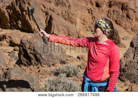 Adventure Female Vloger Using Action Camera Outdoor.